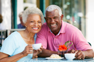 senior couple at a cafe near florida Senior Living Programs
